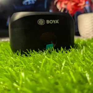 BOYA BY-MW2 wireless live microphone back box showing plug and play, 20 meter reception and clear timbre features